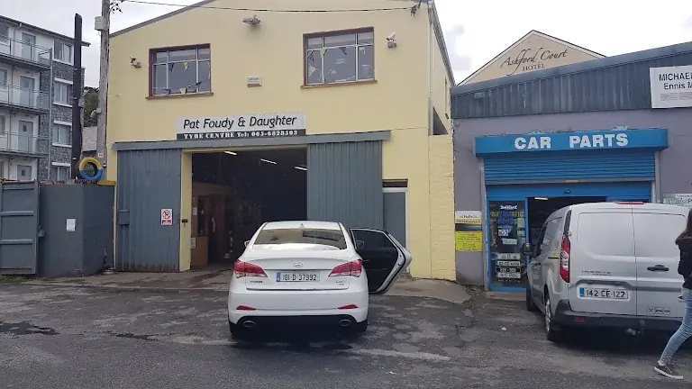 The original Pat Foudy and Daughter Tyre Centre sign over the bay doors on Pound Lane, Ennis